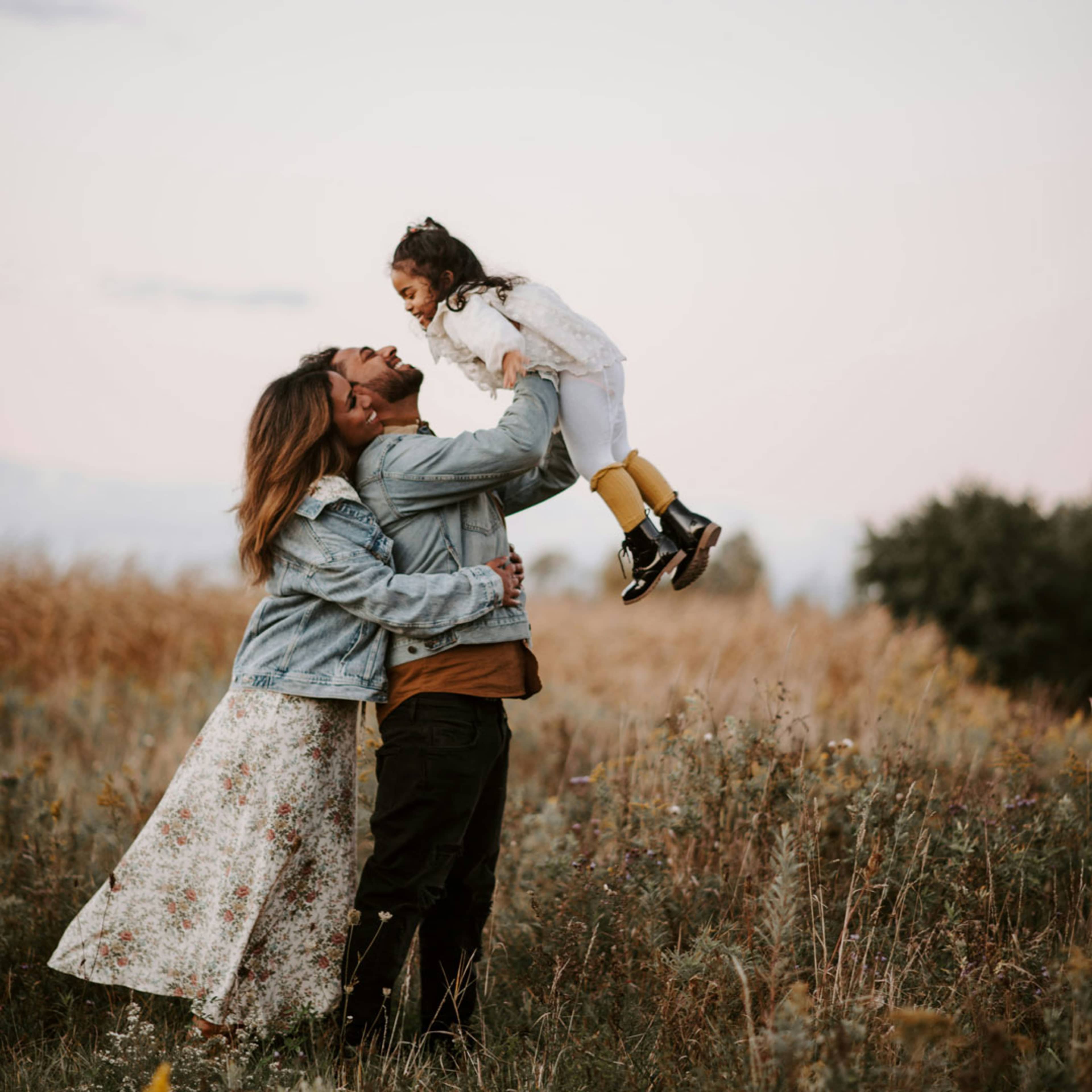 Man and woman playing with child