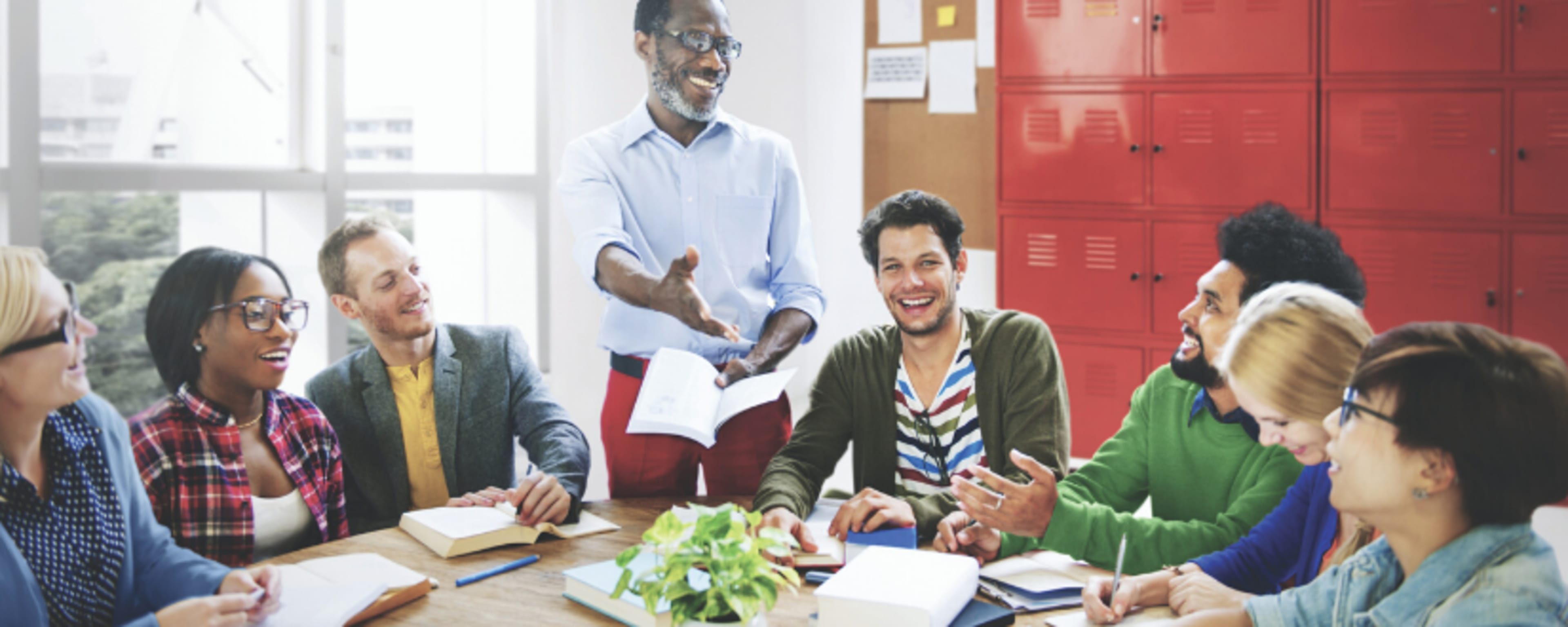 Adults studying at a table