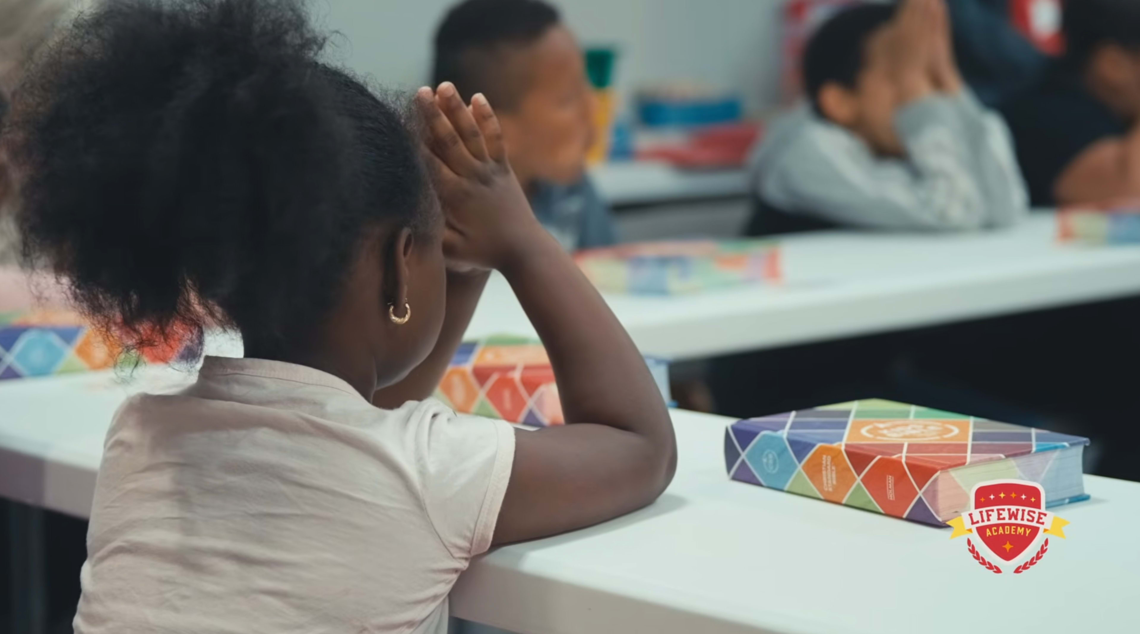girl praying at school