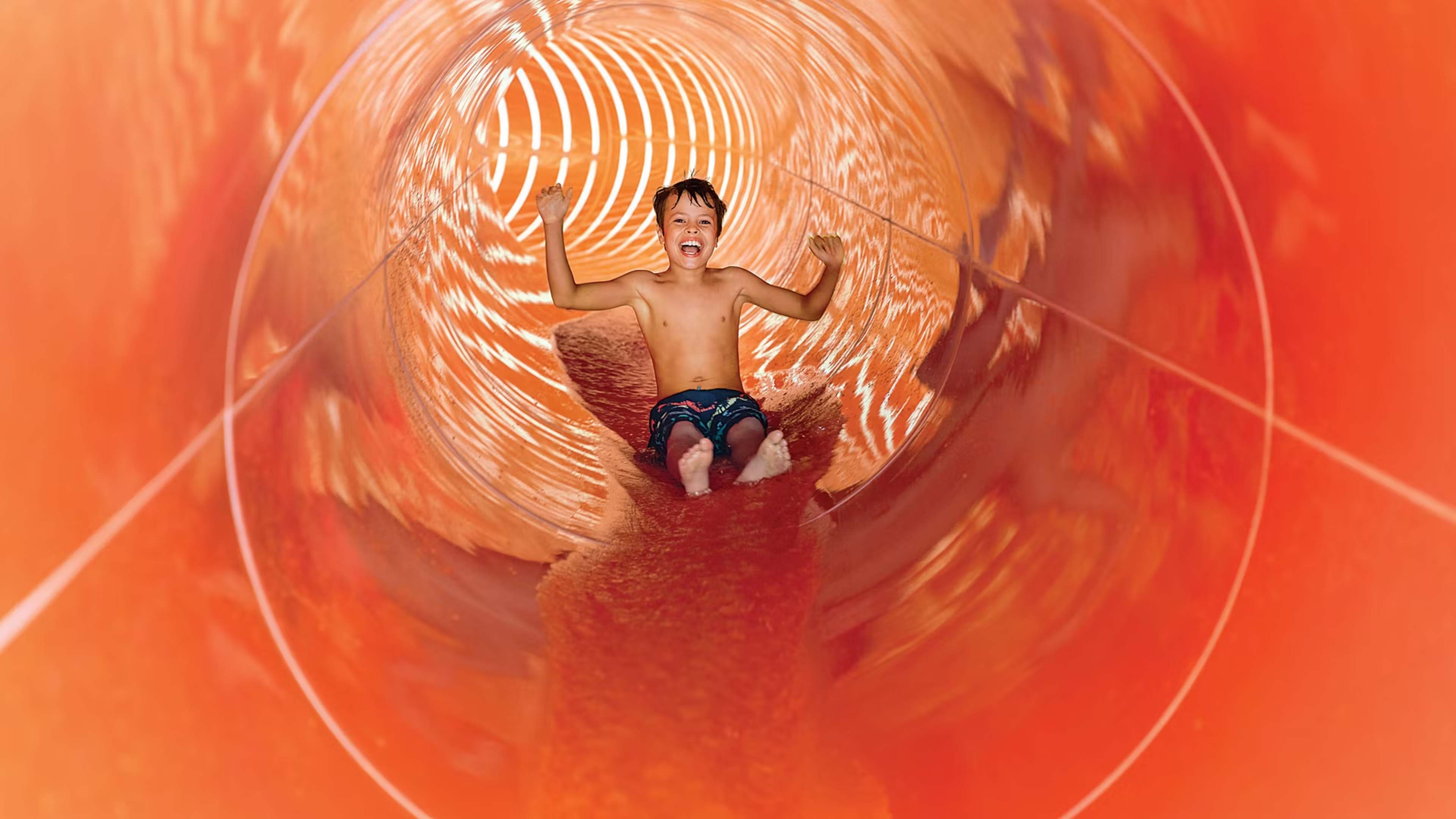 kid in water slide