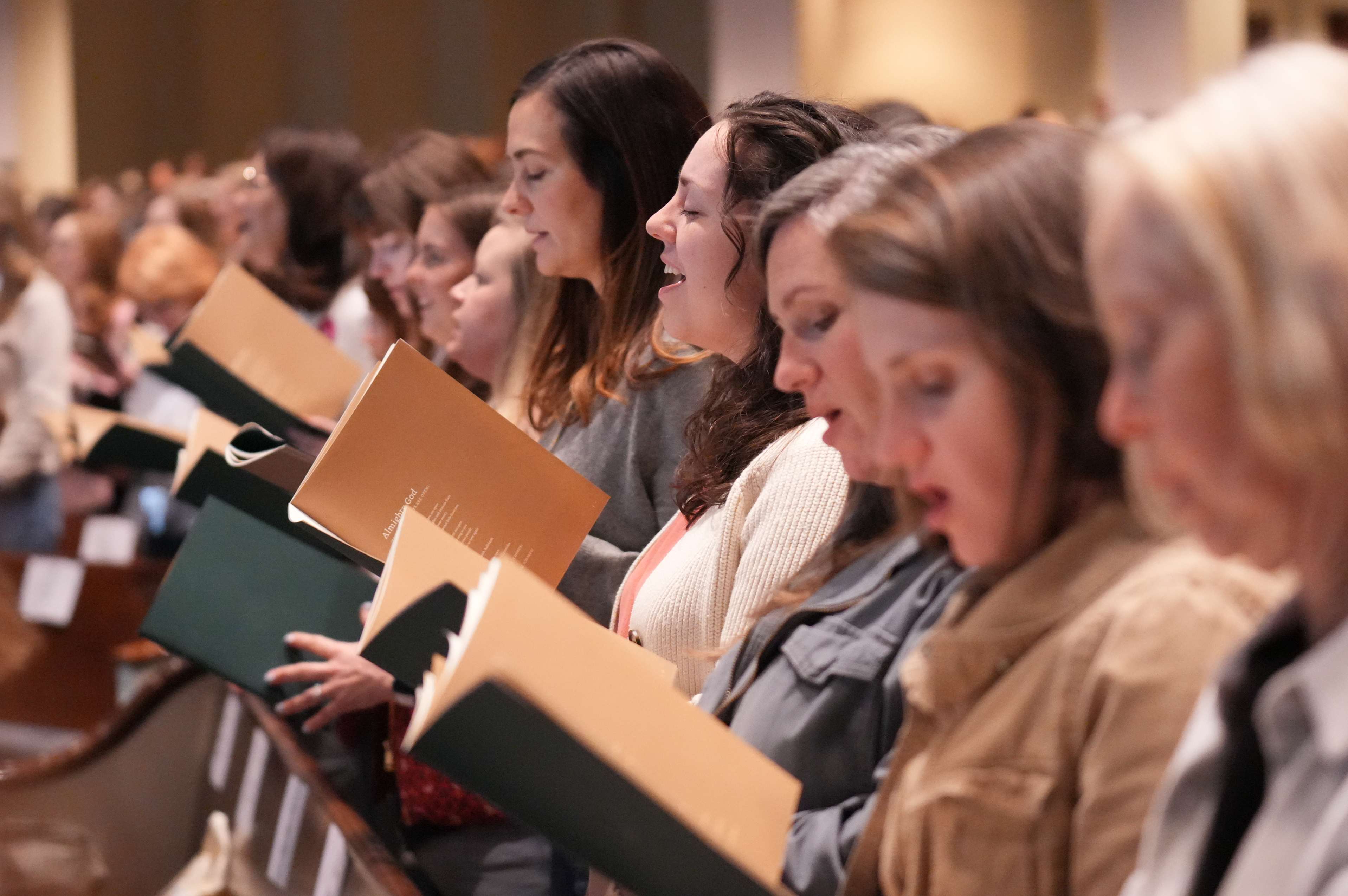 Women in chairs singing