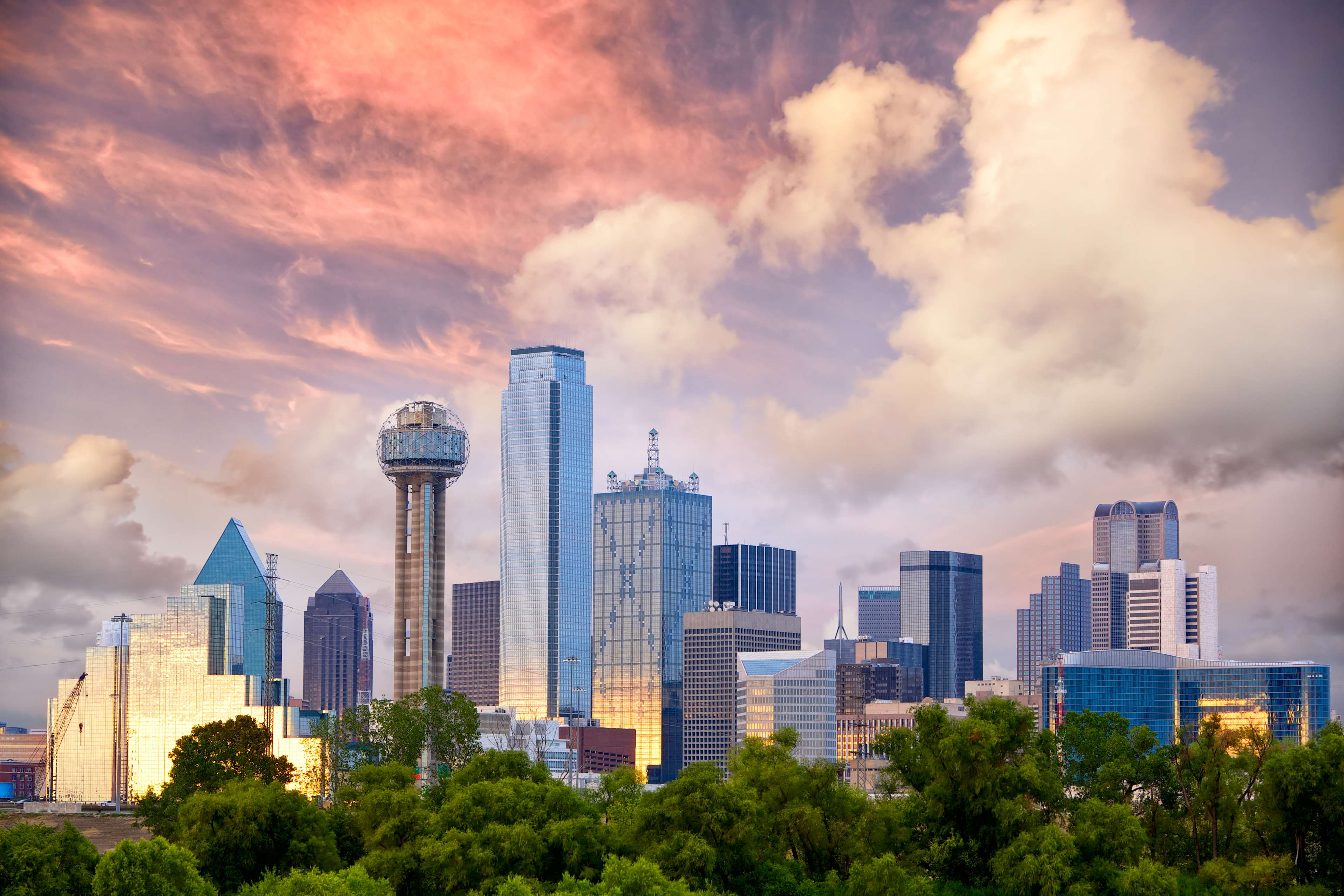 Skyline of Dallas, TX with cloudy skies