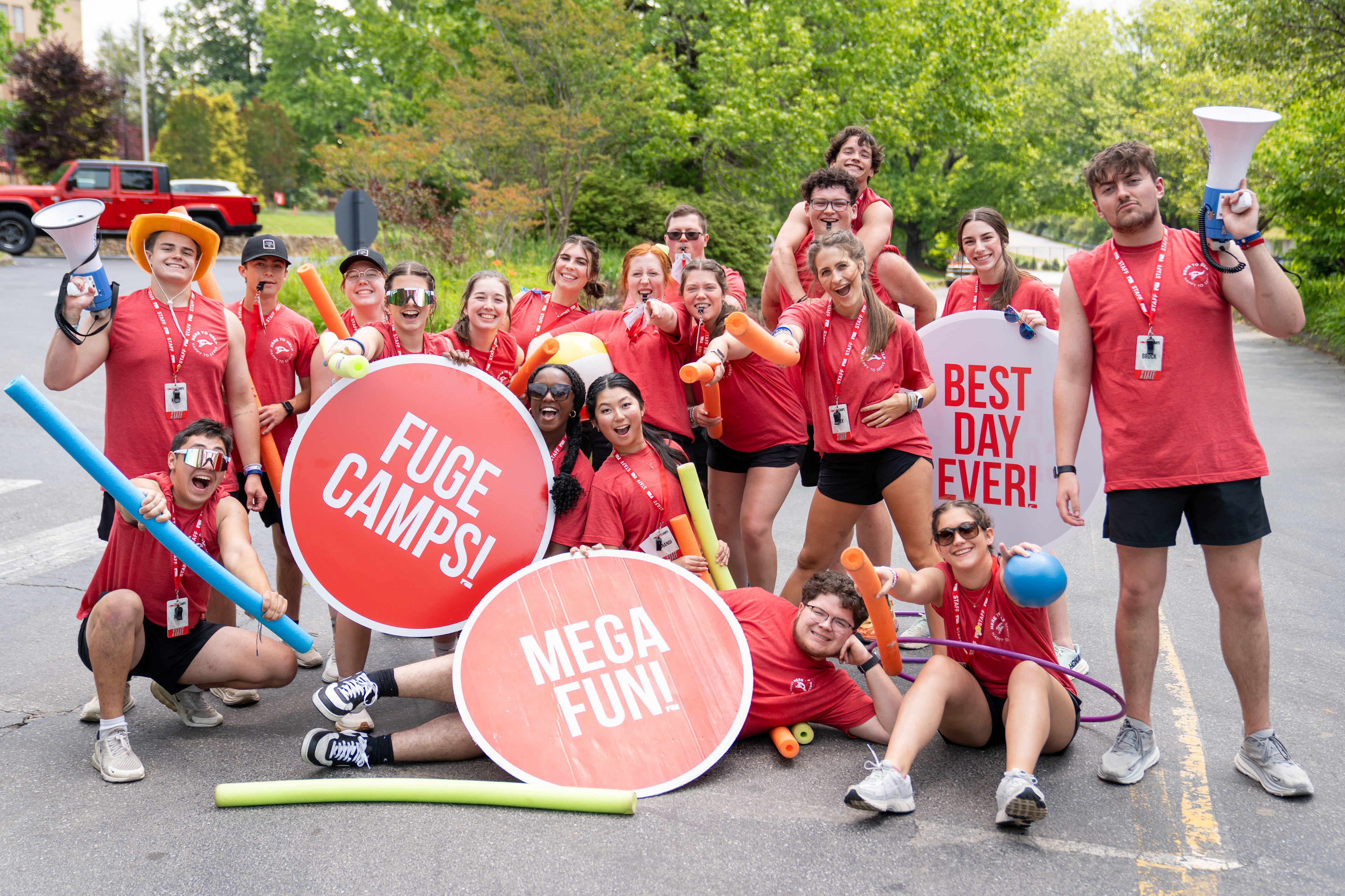 Camp leaders holding signs for Fuge Camps