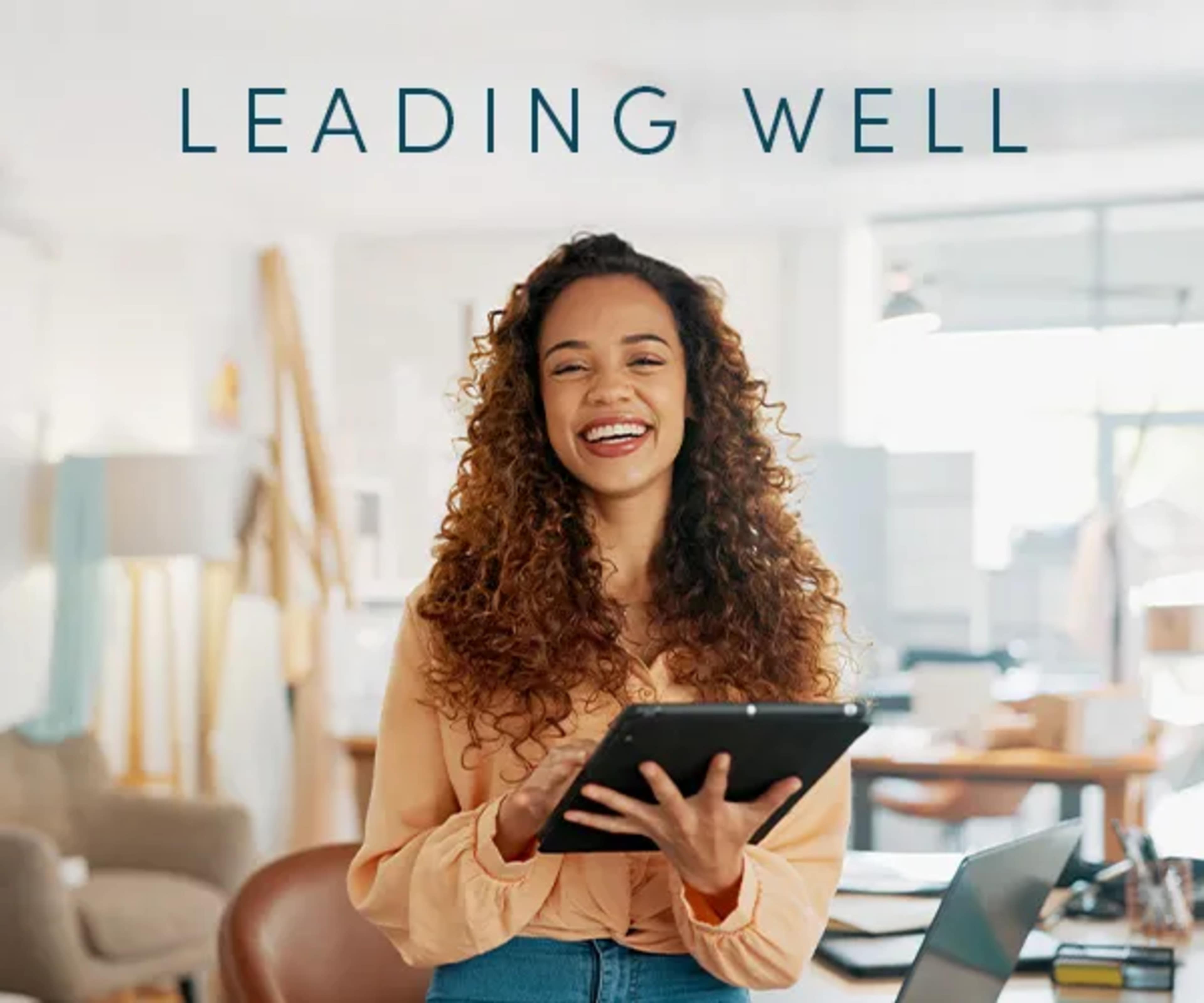 Leading Well with woman holding ipad