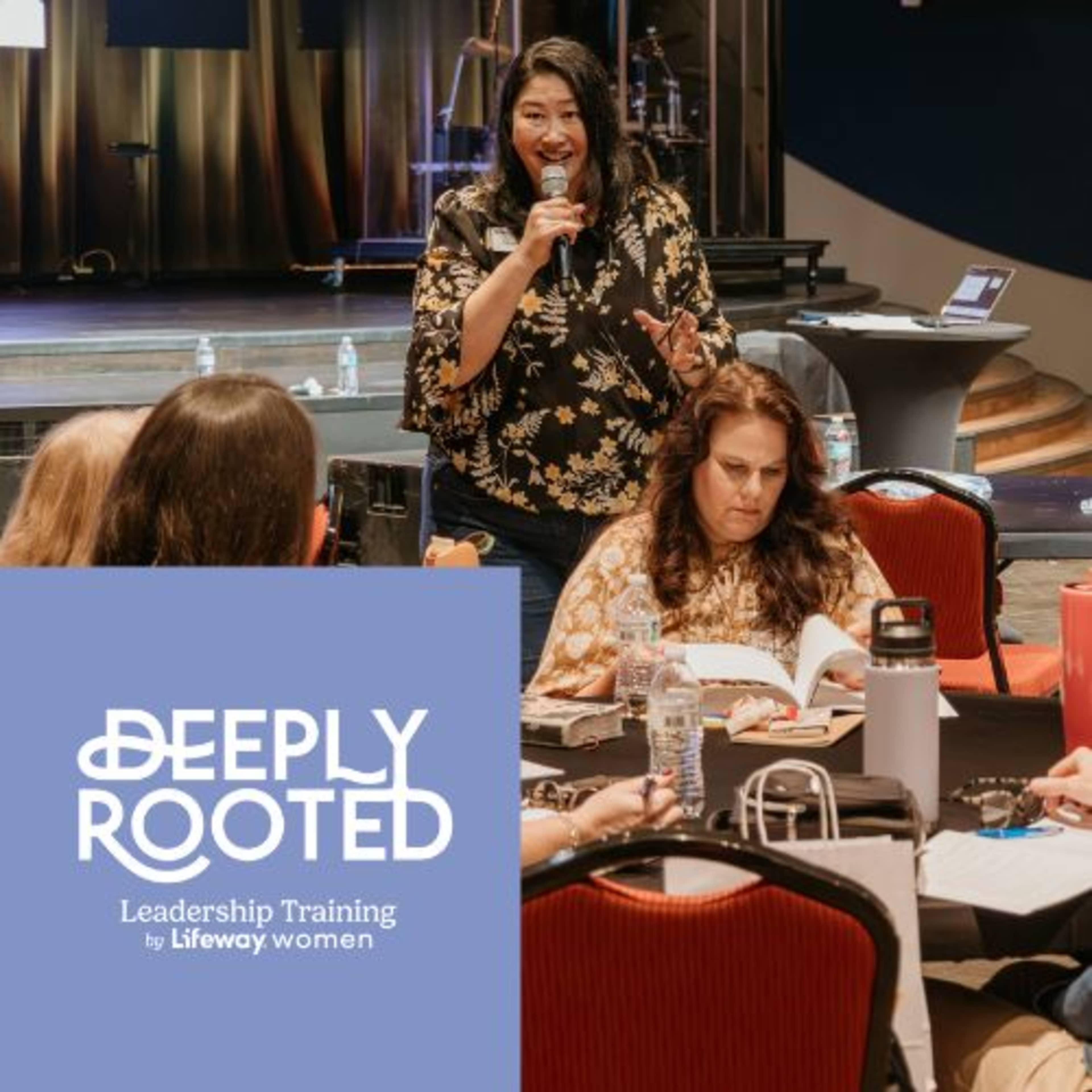 Woman speaking to women at table