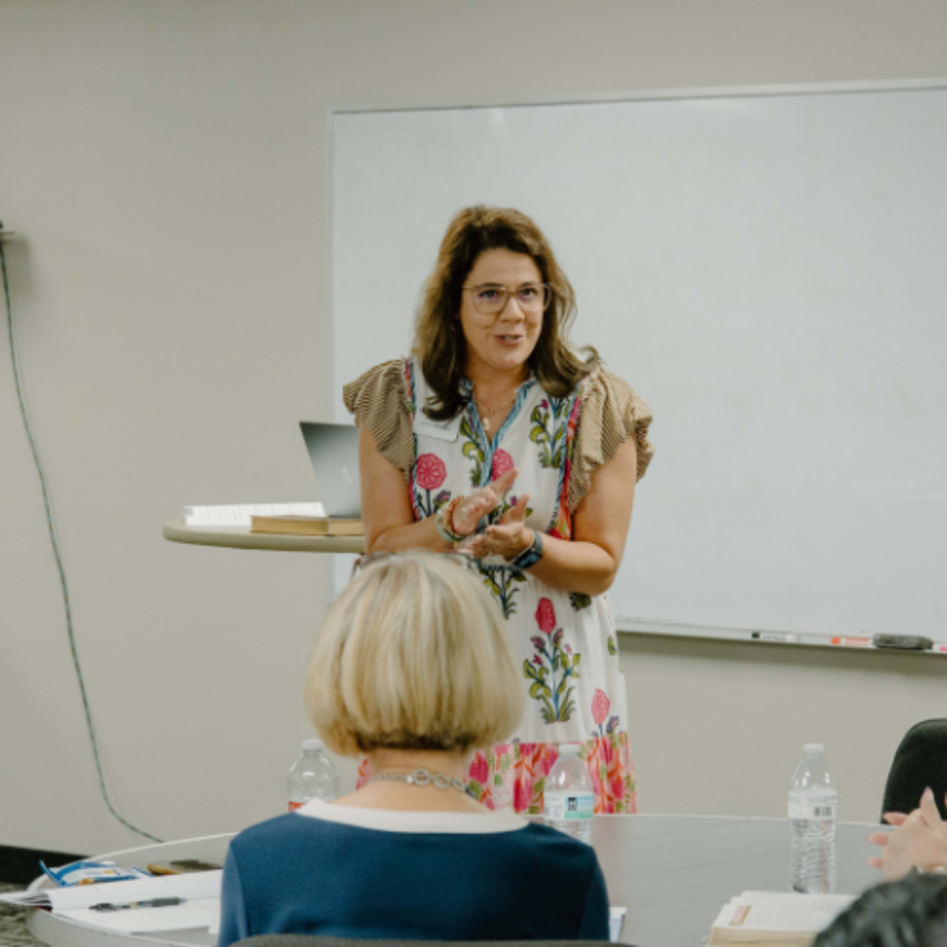 Female teacher speaking to audience