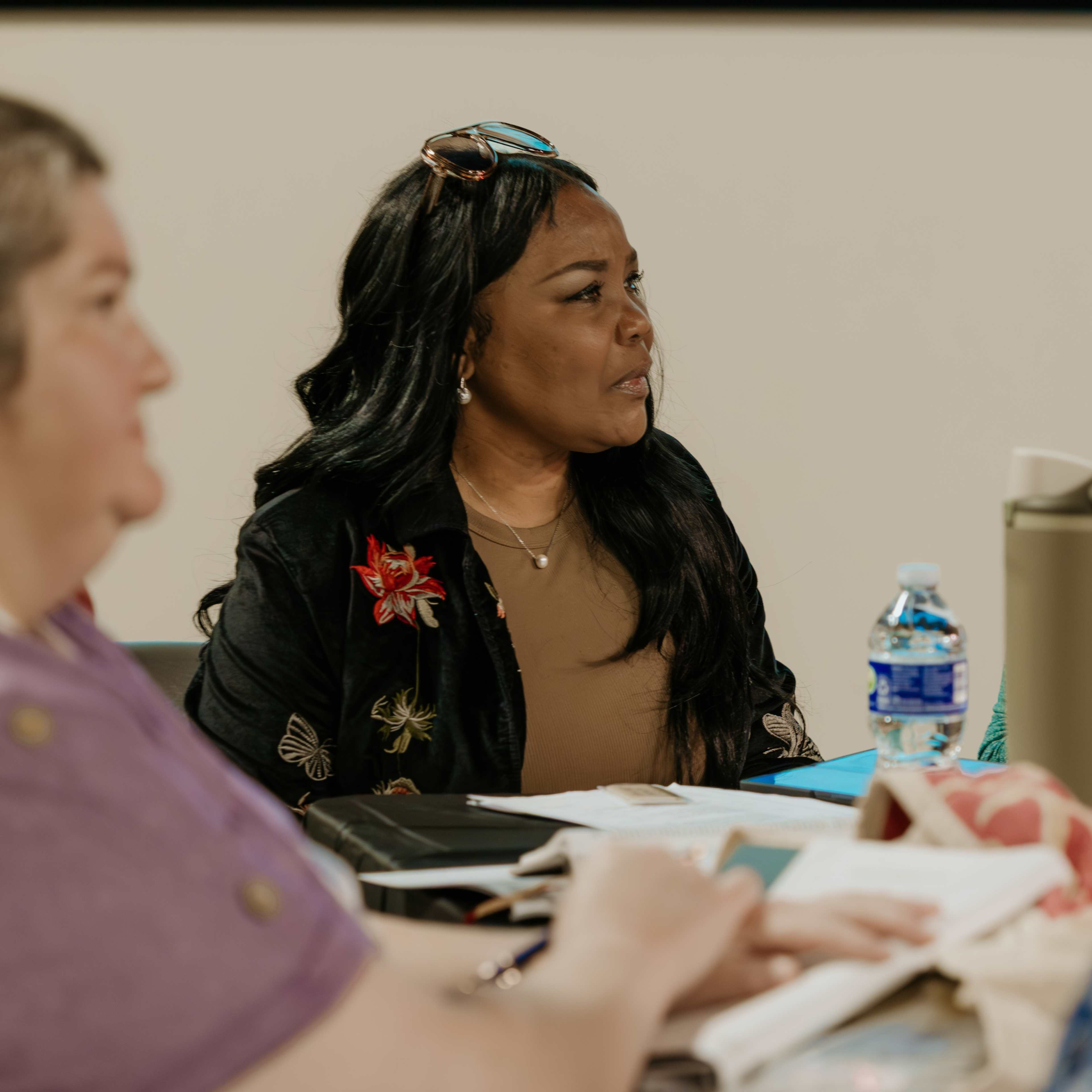 Women sitting at table talking and studying