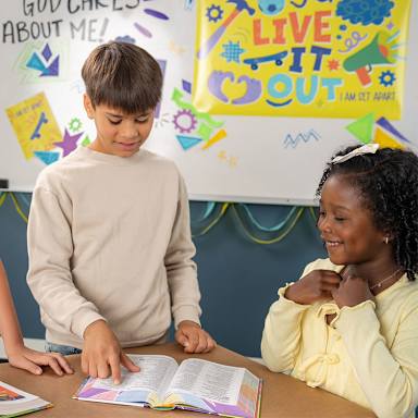Boy and girl reading Bible