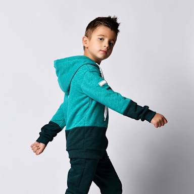 boy walking looking at camera