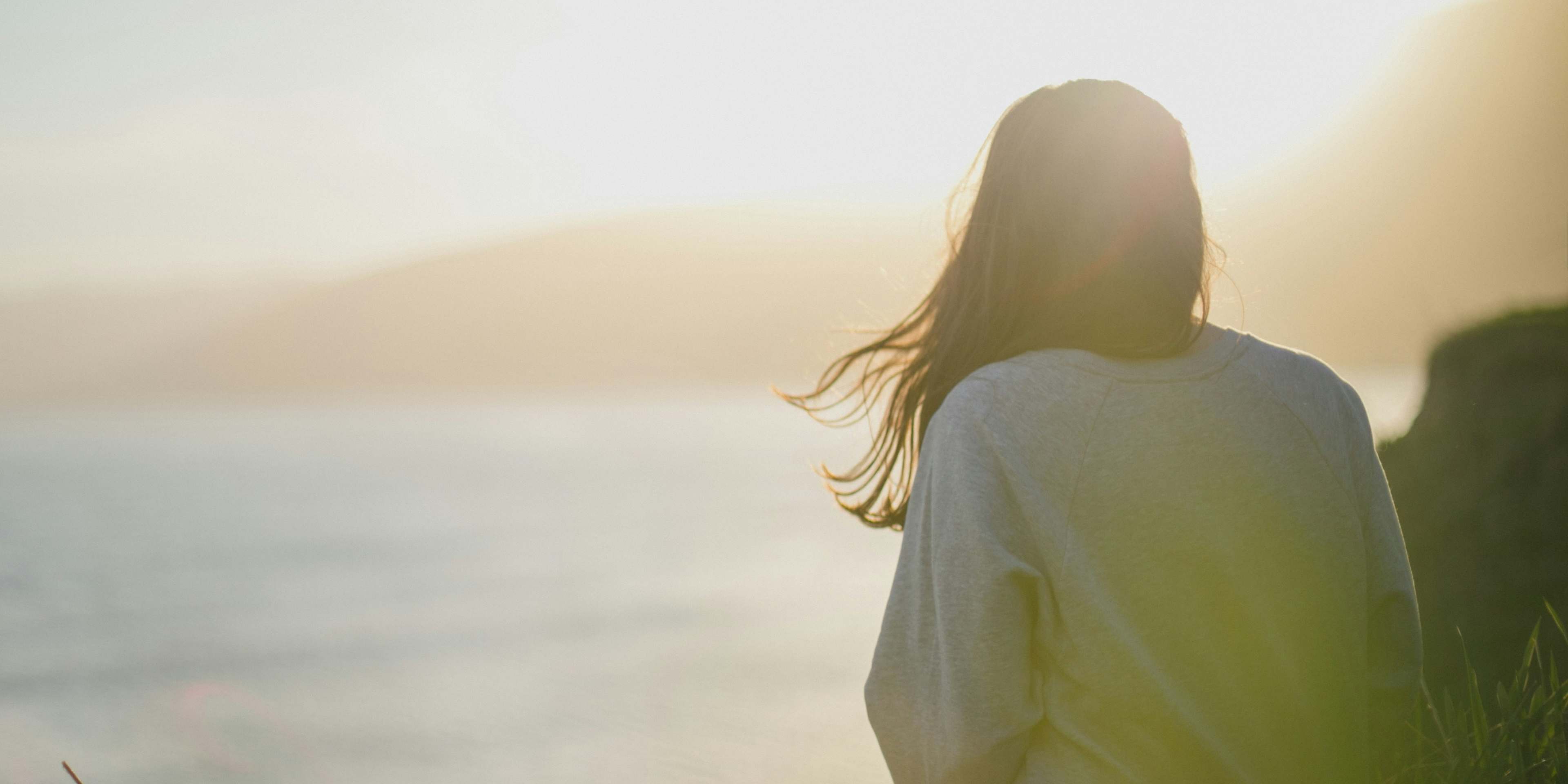 woman looking at ocean