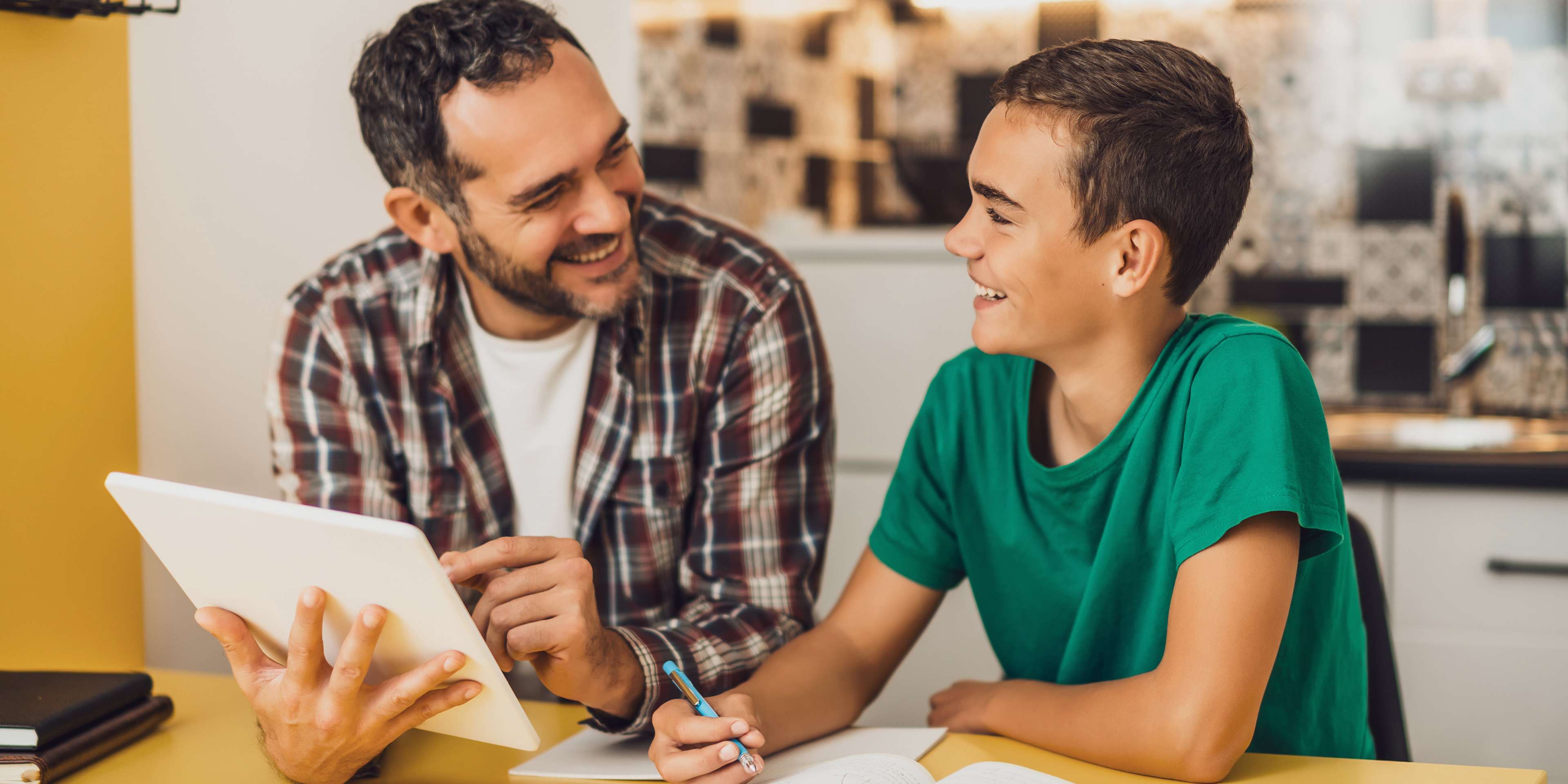 dad and son studying together