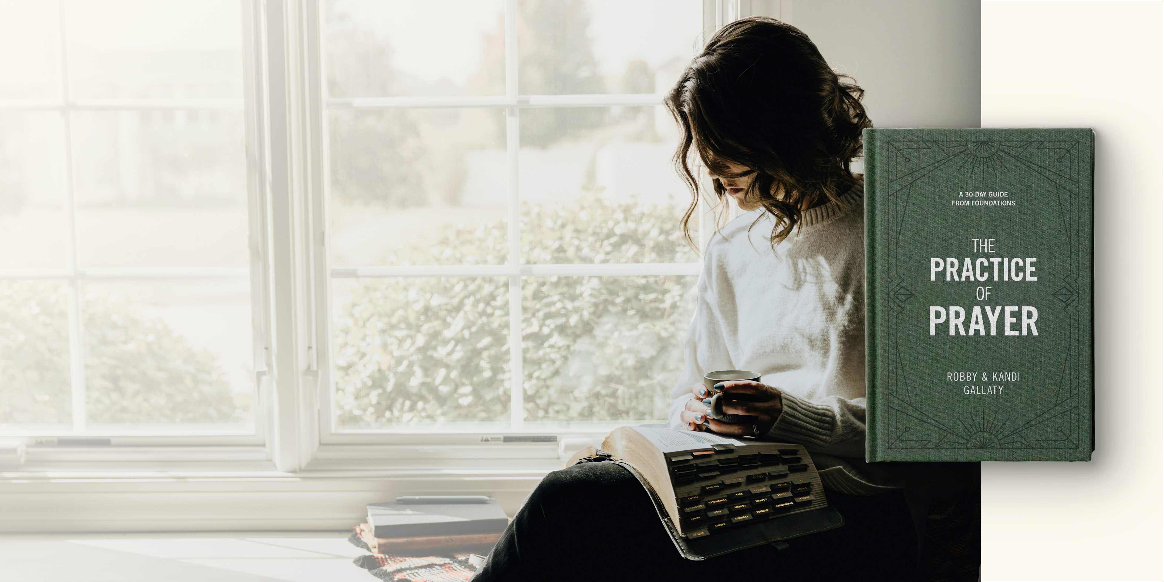 woman reading the bible beside of a window