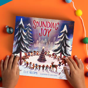 Sounding Joy book with Christmas decor around it