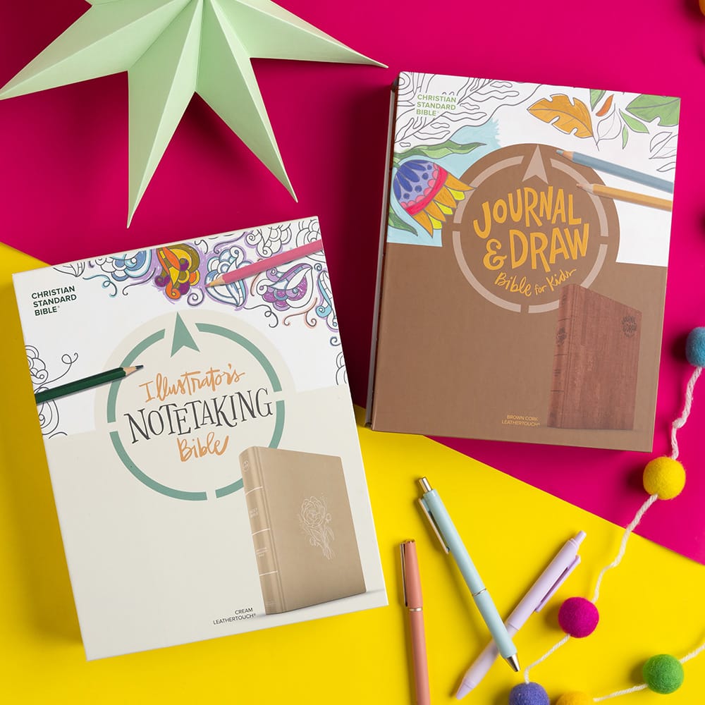 Two kids Bibles on wrapping paper