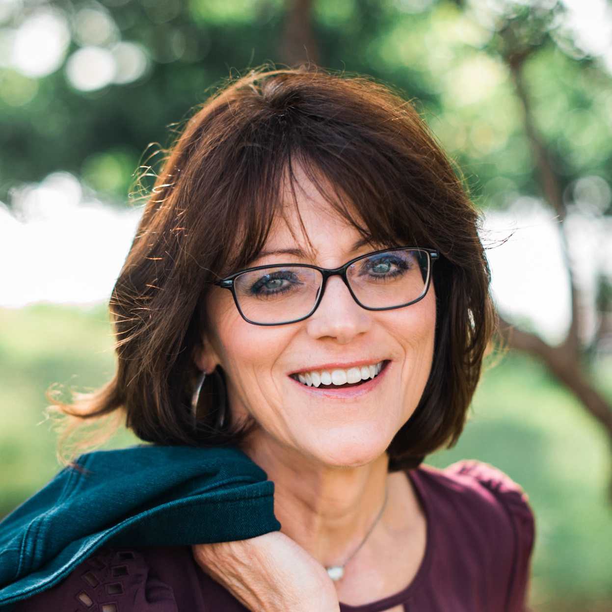 Kathy Howard wearing glasses smiling