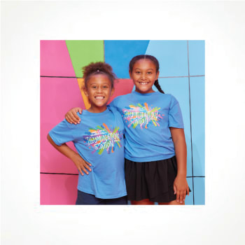 Two children smiling with arms around shoulders