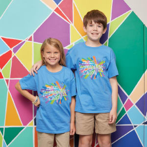 Boy and girl smiling wearing blue t-shirts