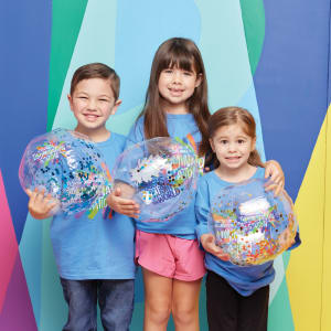 kids in VBS shirts smiling