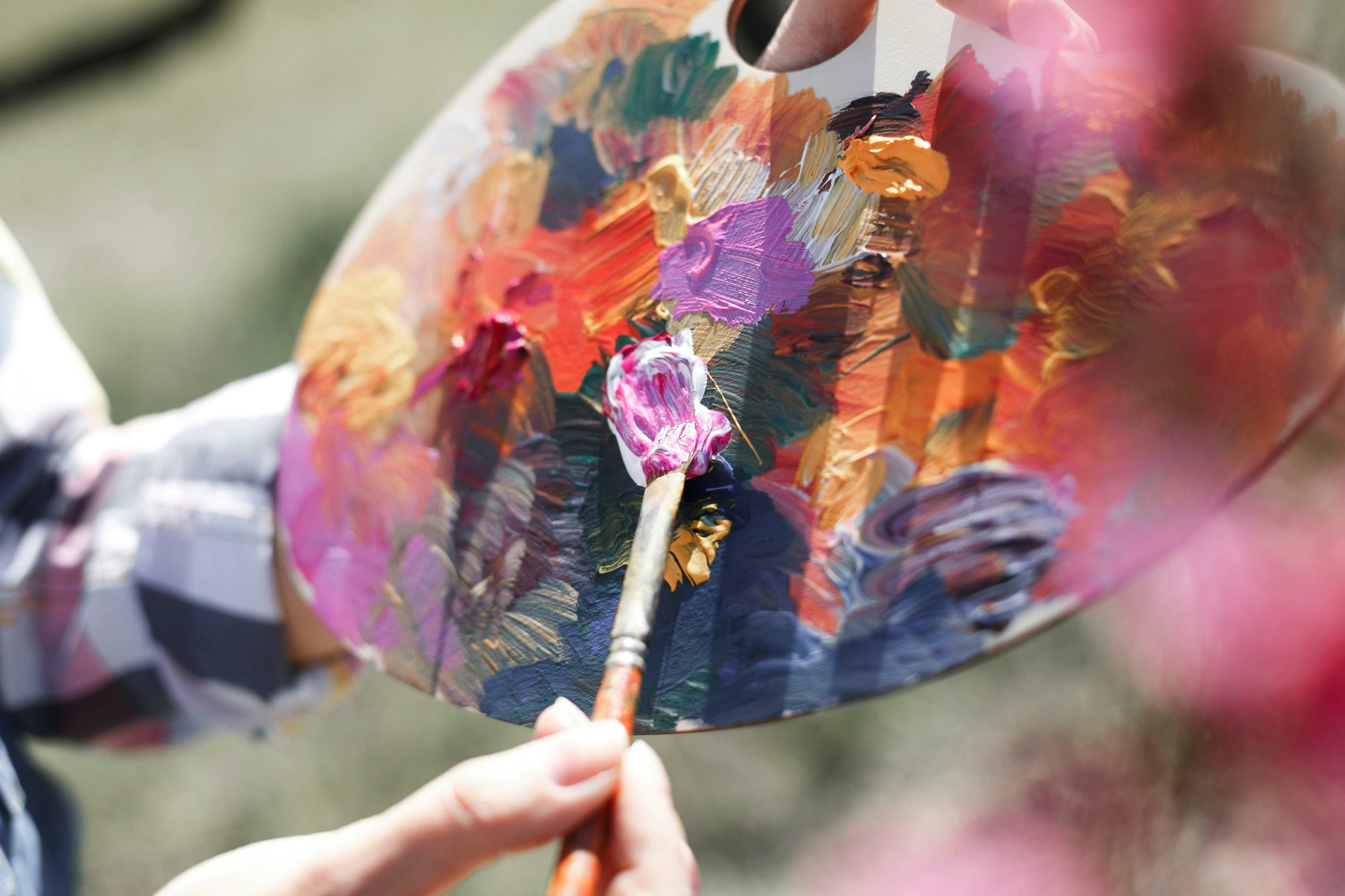 artist with a paintbrush and paint