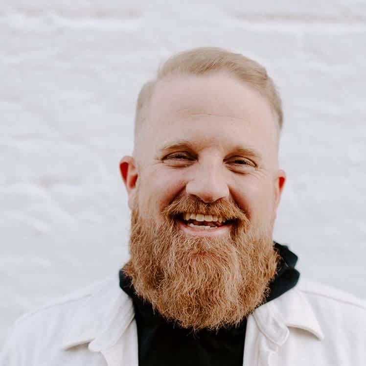 Zac Workun headshot with tree in background