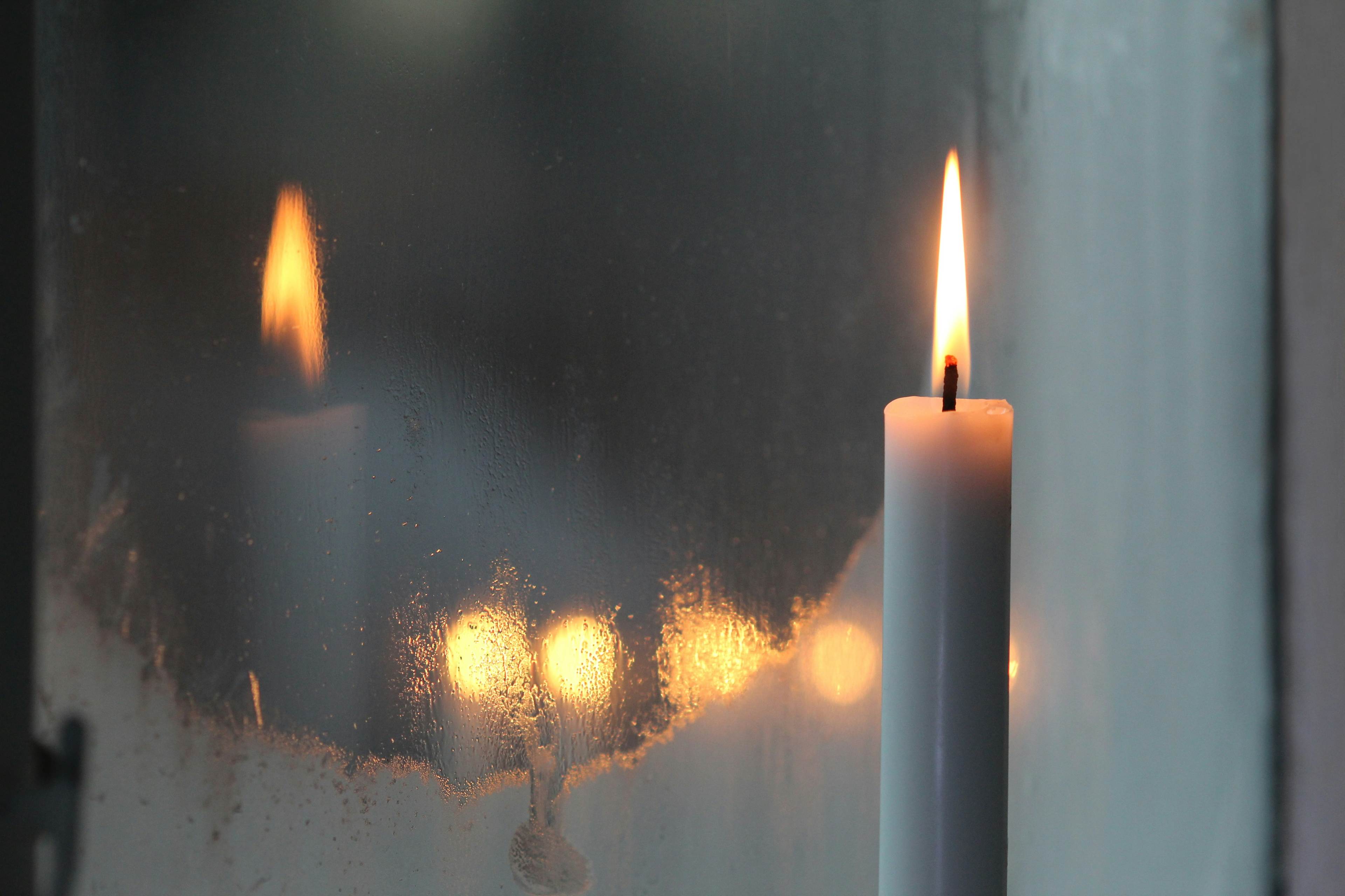 candle in a window sill