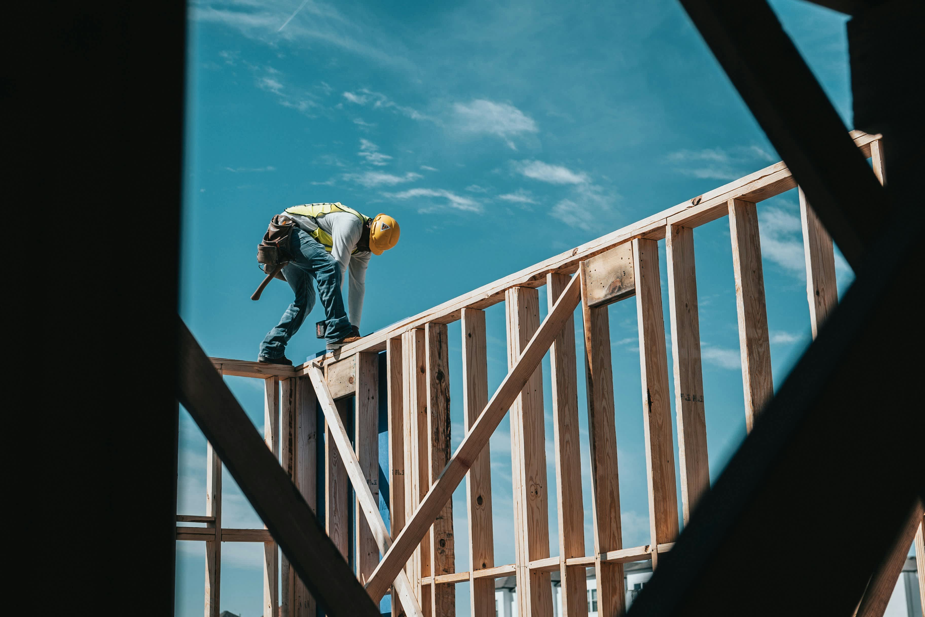 man building a house