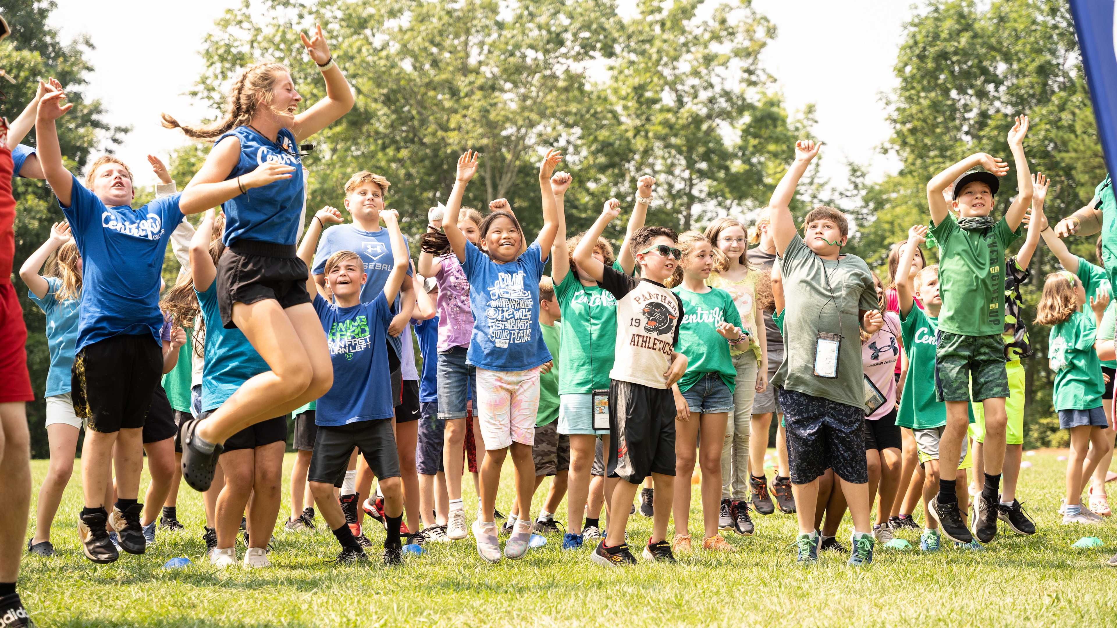 Group of kids jumping with arms raised