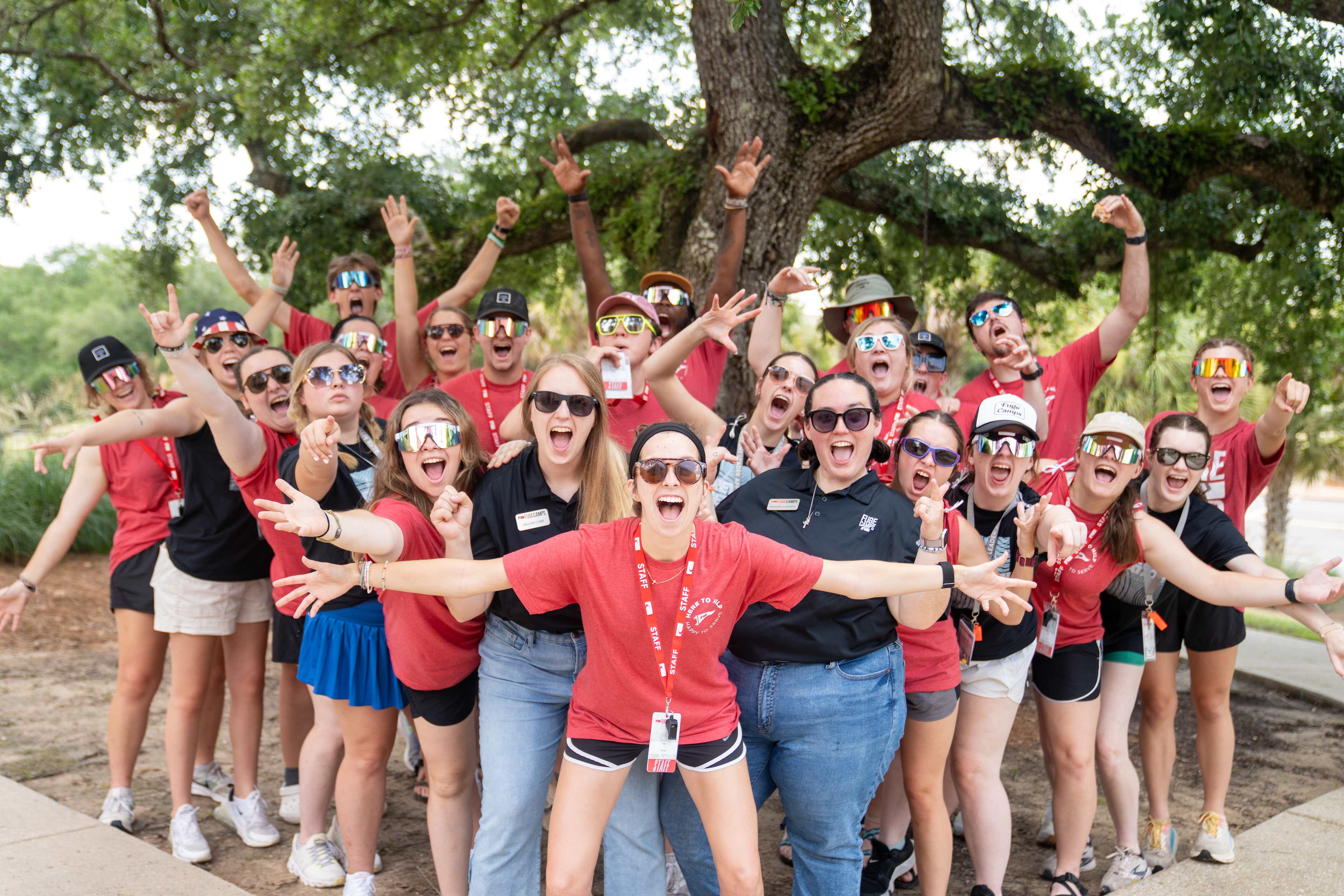 High schoolers at summer camp muddy and smiling