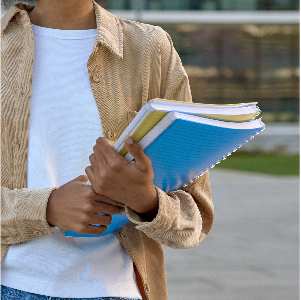 girl holding books
