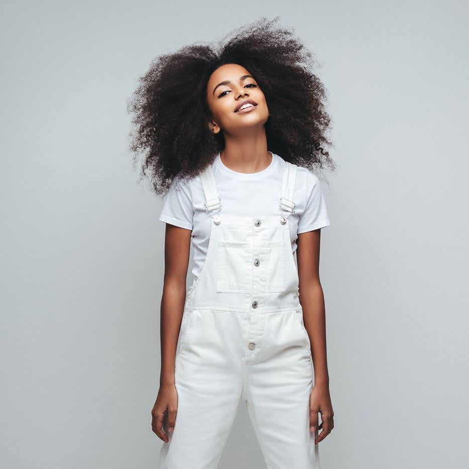 Young lady standing facing you