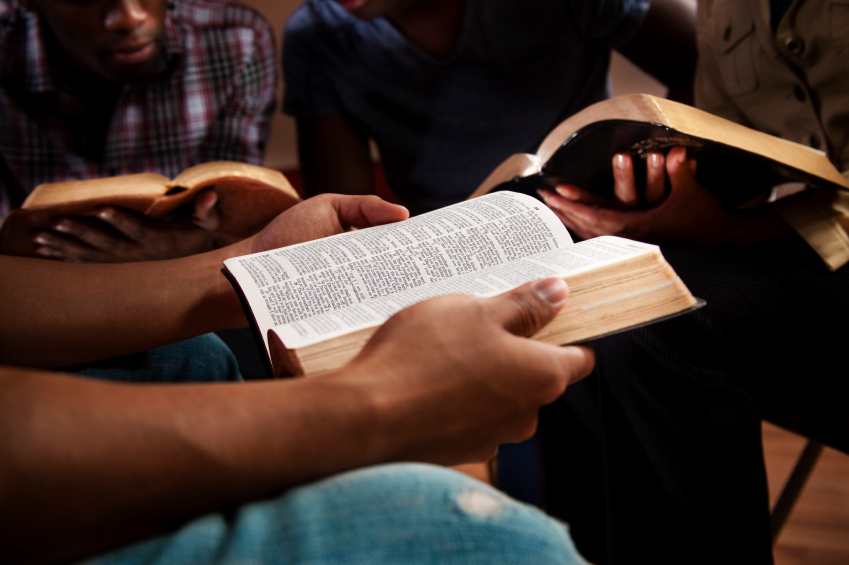 Group of people studying the Bible in small group