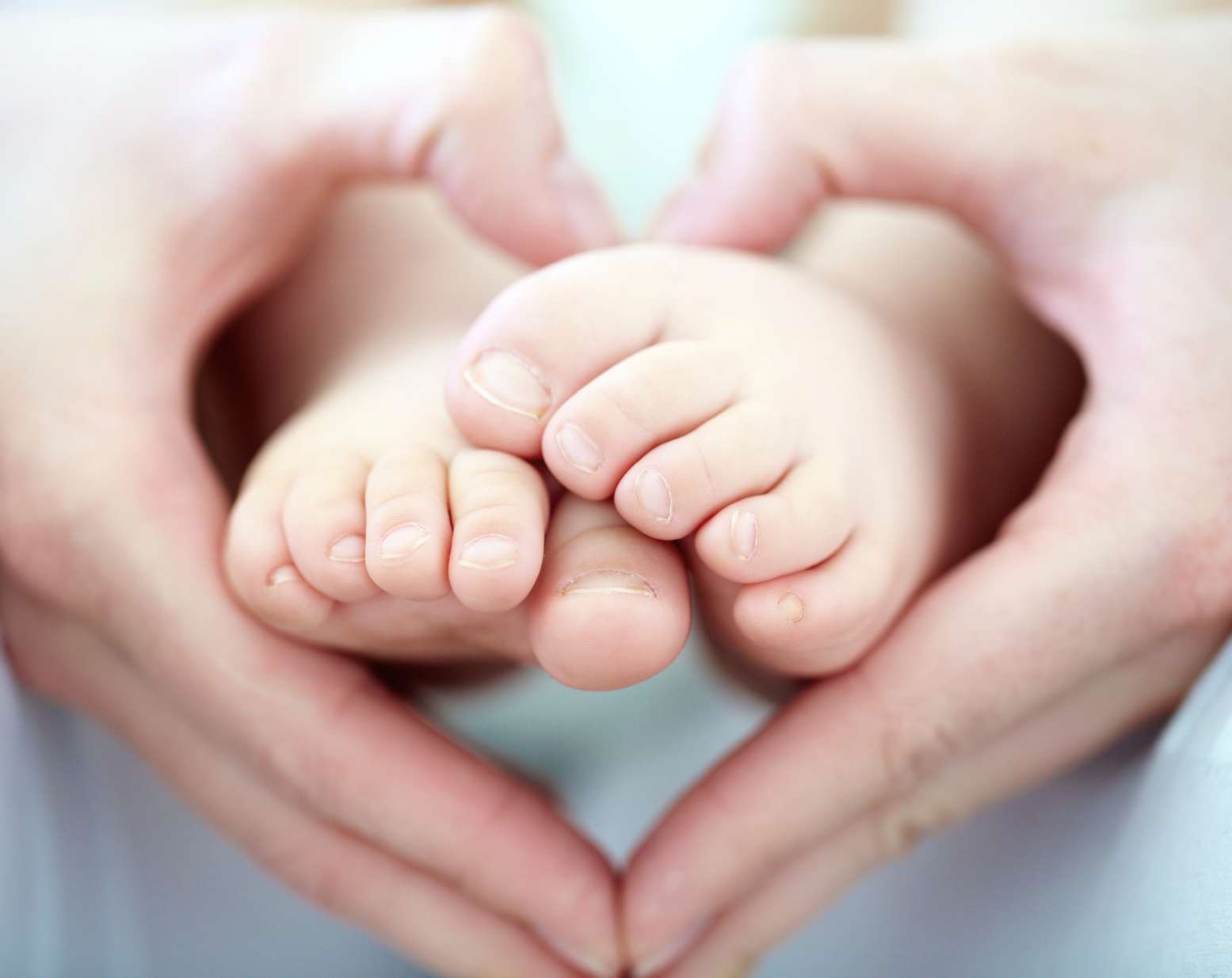 grace based parenting, mom and dad holding baby