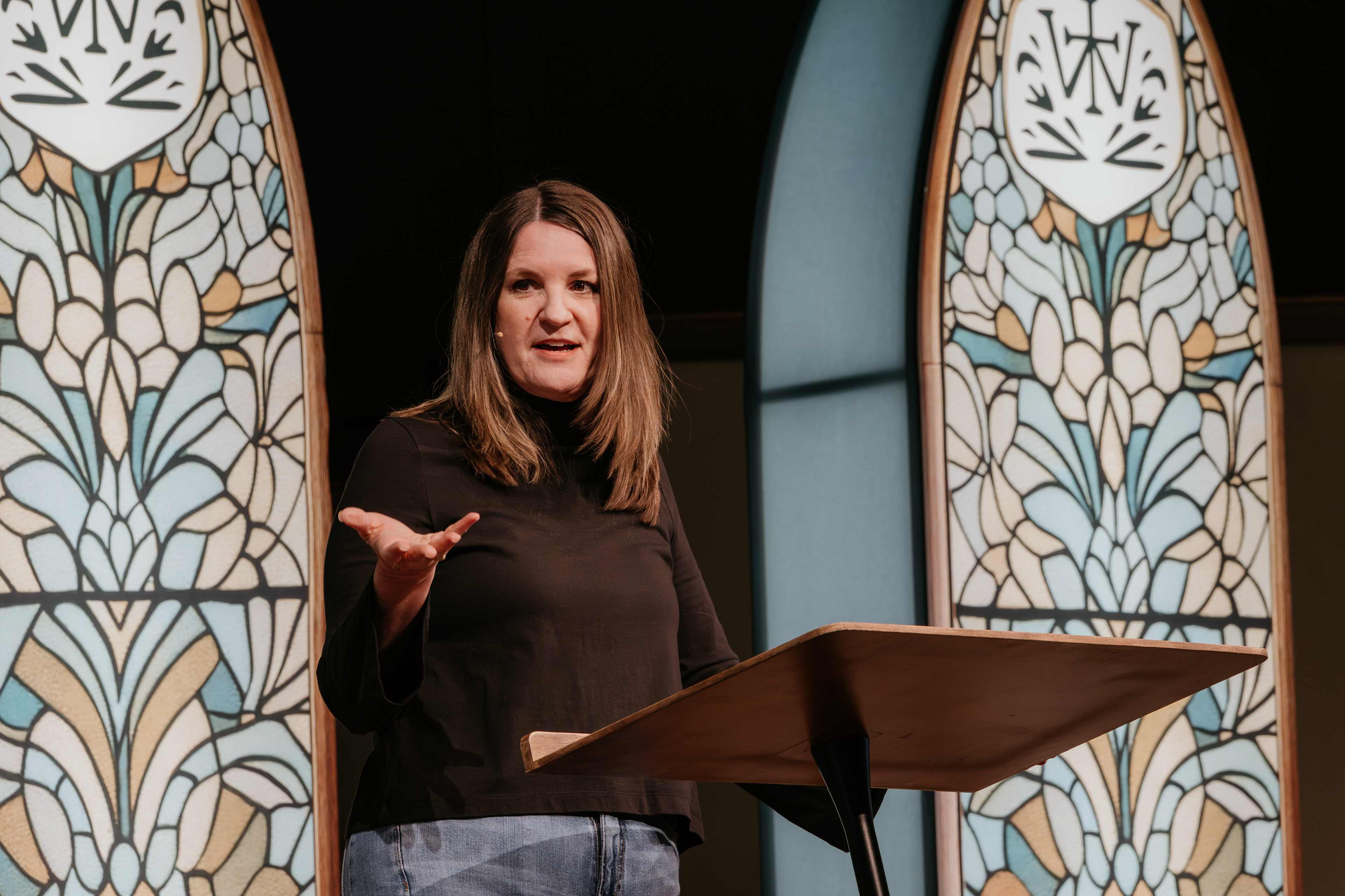 Jen Wilkin speaking at podium on stage
