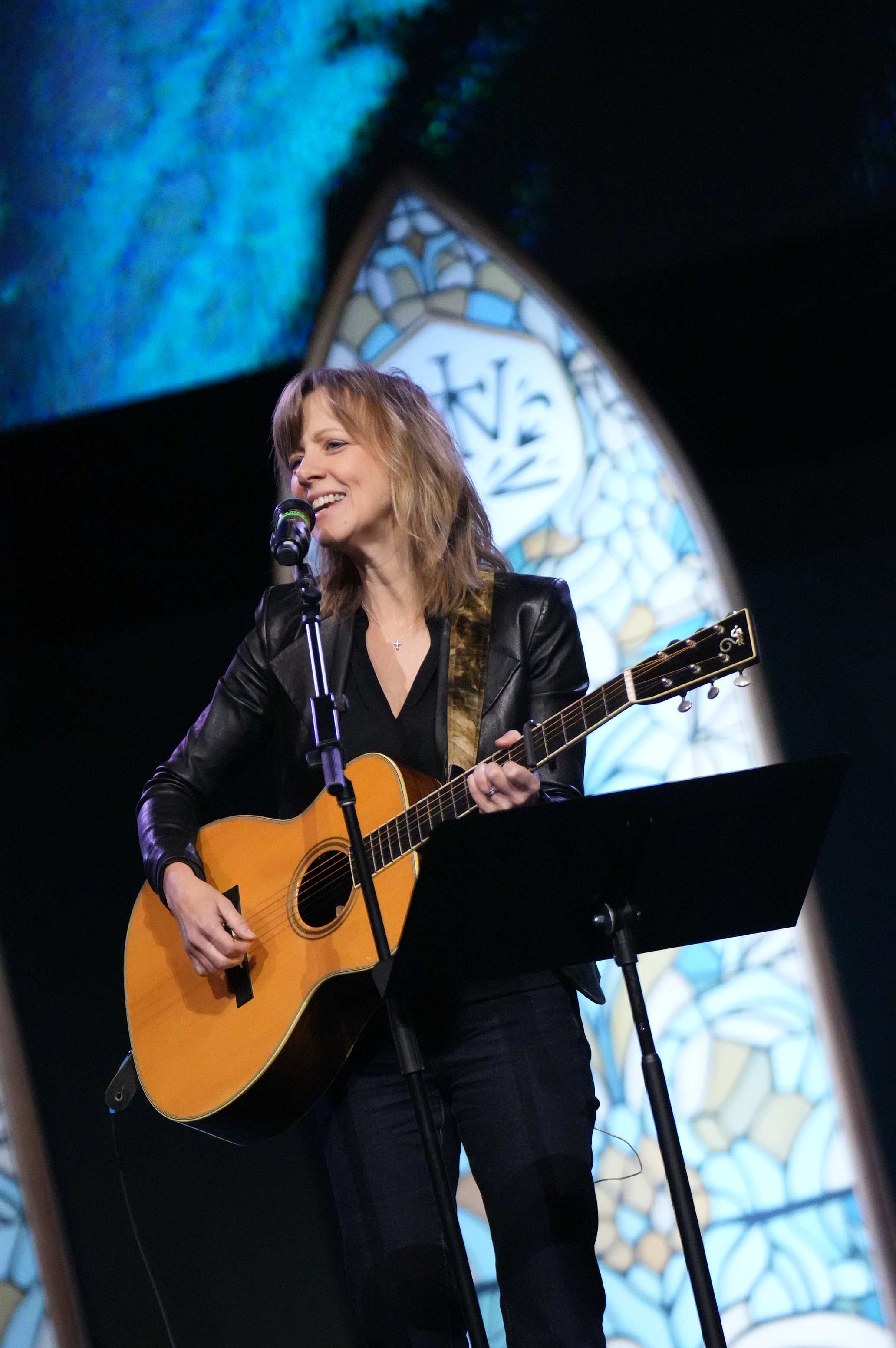 Sandra McCracken leading worship with guitar