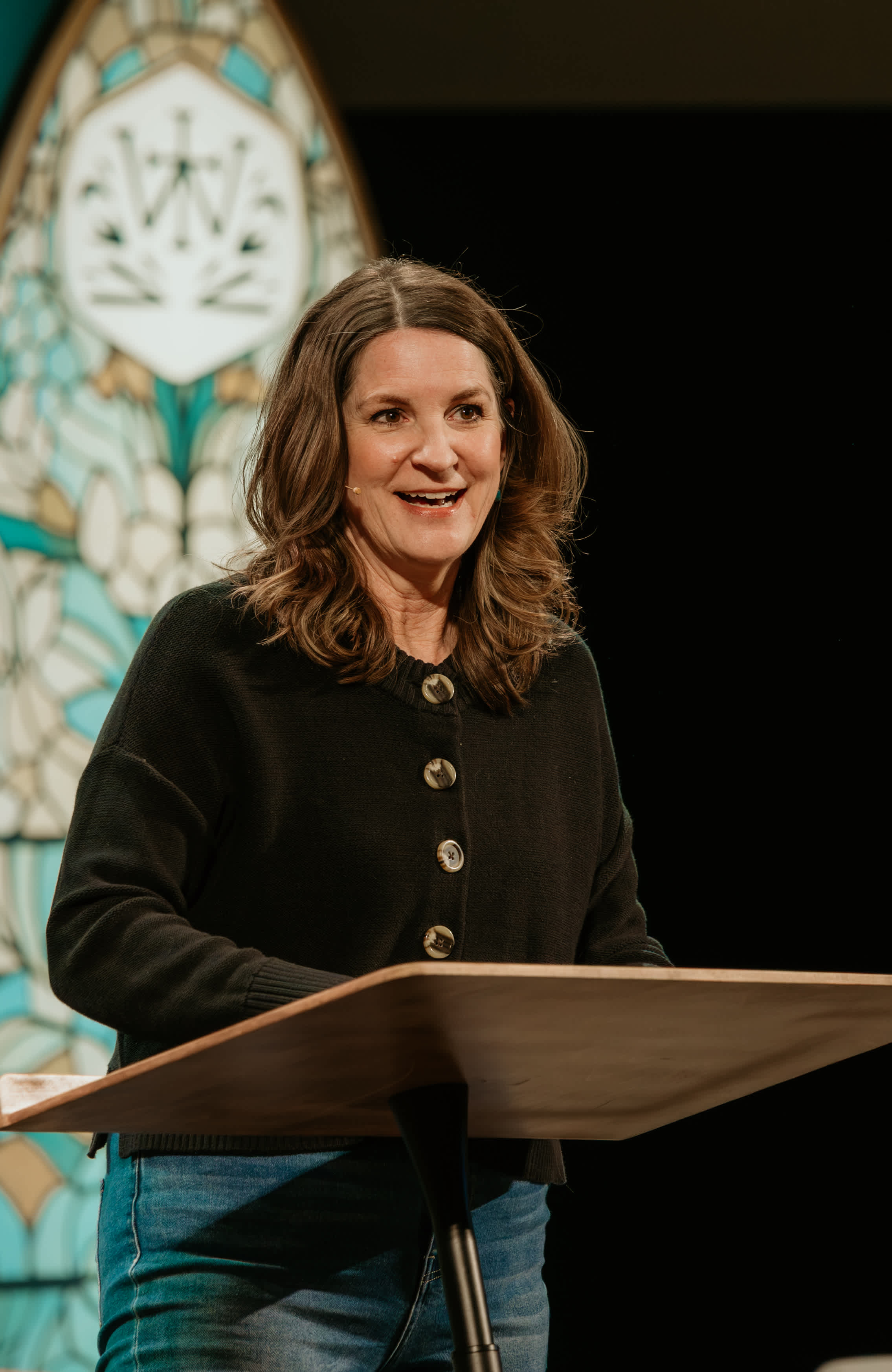 Jen Wilkin speaking at podium on stage