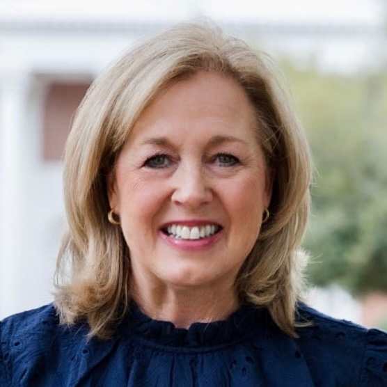 Kelly King wearing dress coat and smiling