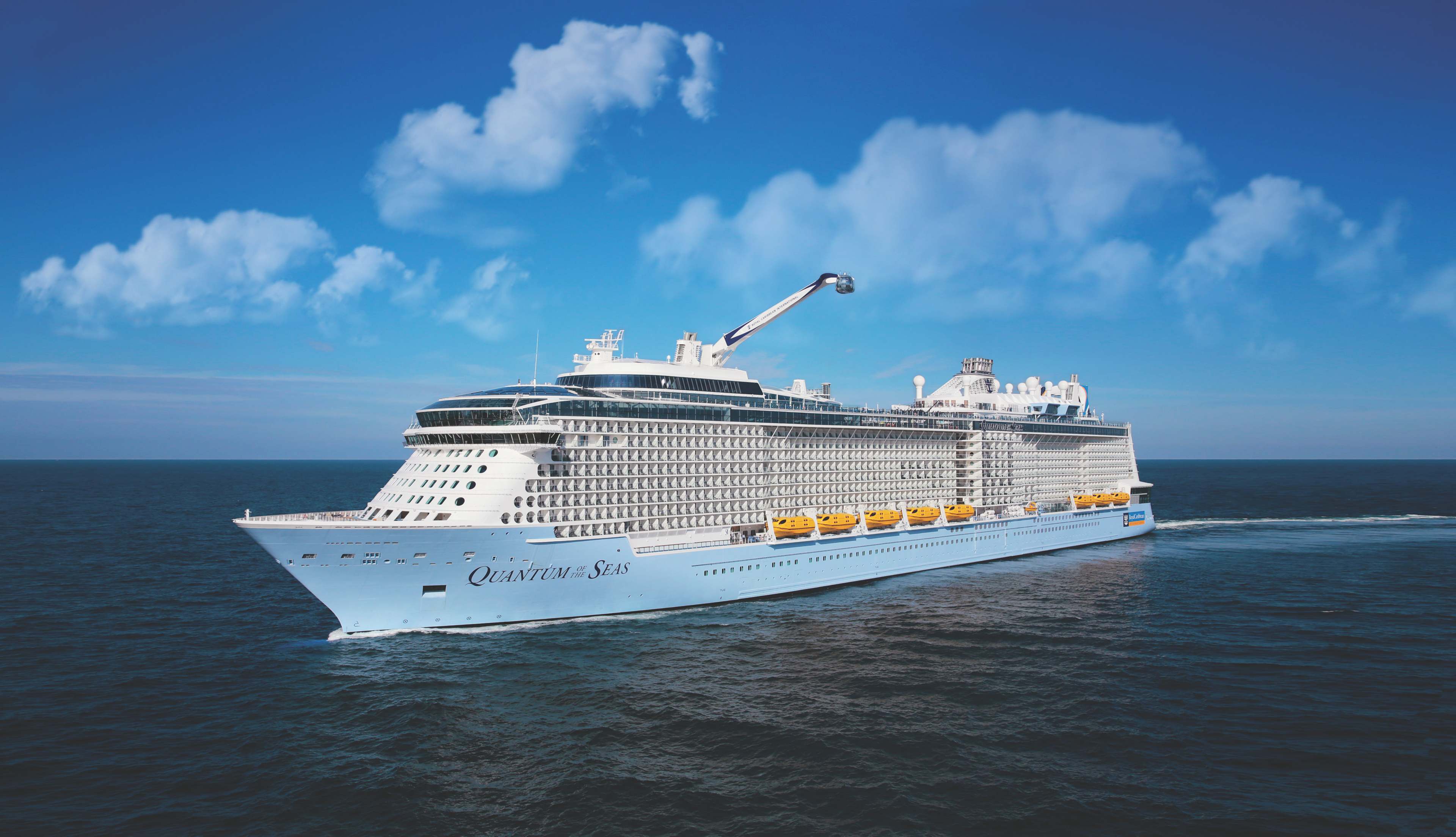 Royal Caribbean Quantum of the Seas ship in the ocean with a blue sky