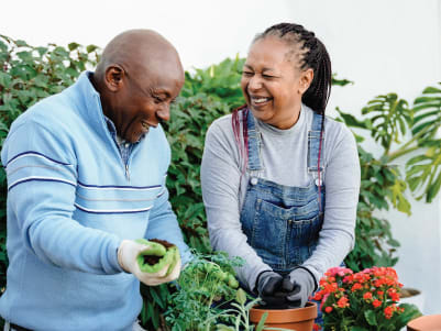 couple planting flowers