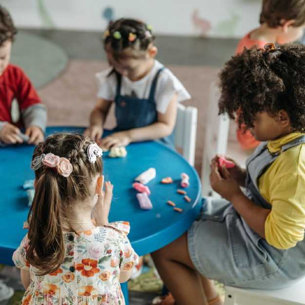 kids doing craft table