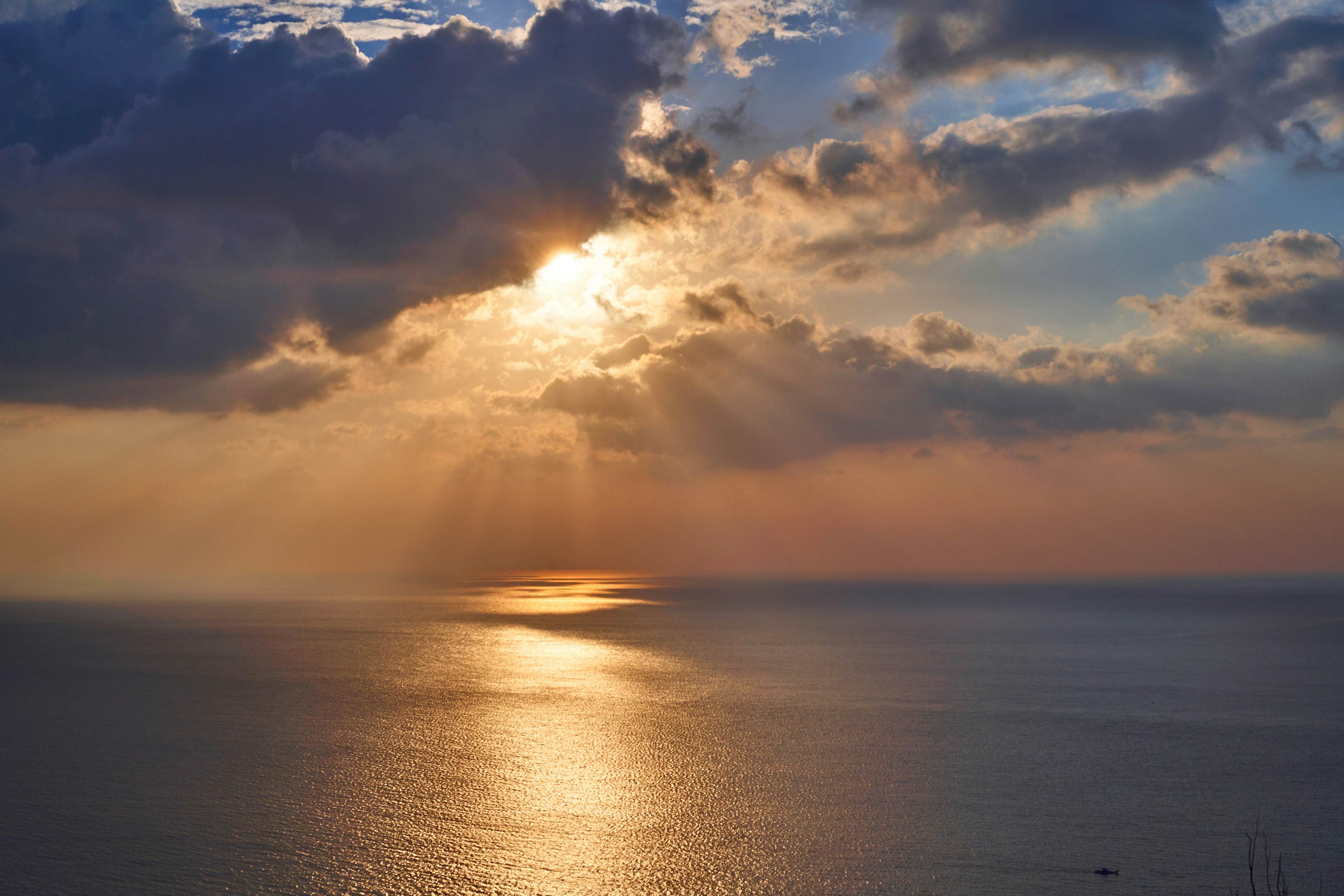 clouds over the ocean at sunset