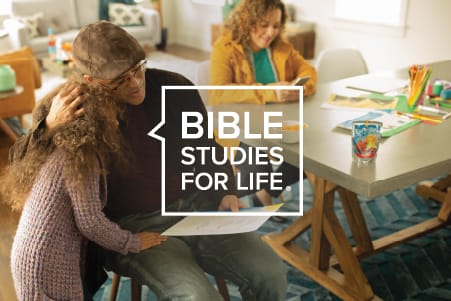 dad hugging daughter and Bible Studies for Life logo placed on top