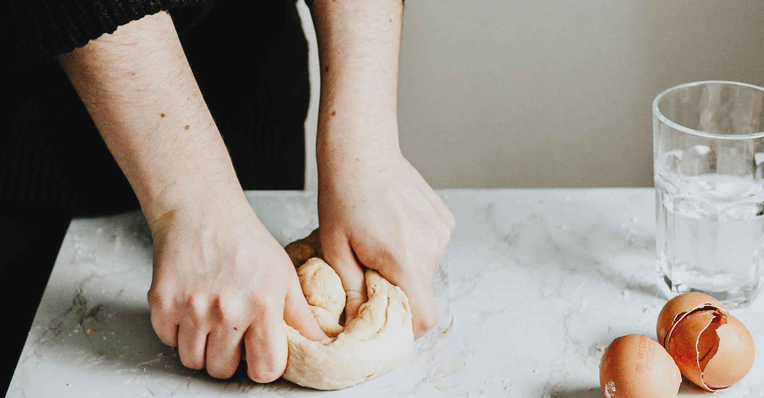 Woman kneading bread